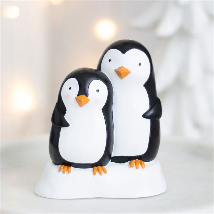 Snuggle season resin penguin ornament