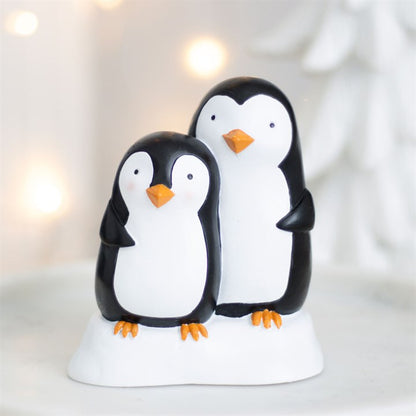 Snuggle season resin penguin ornament